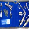 McGivney Hemorrhoidal Ligator Set with Kelly Proctoscope presented in blue padded case, stainless steel proctology surgical instruments.